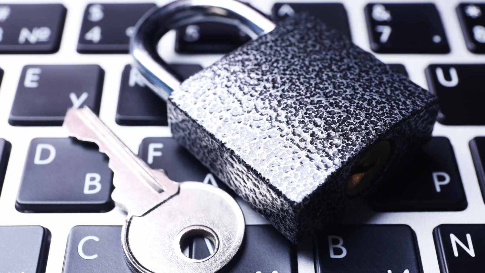 padlock and key on keyboard for cybersecurity supply chain hack prevention