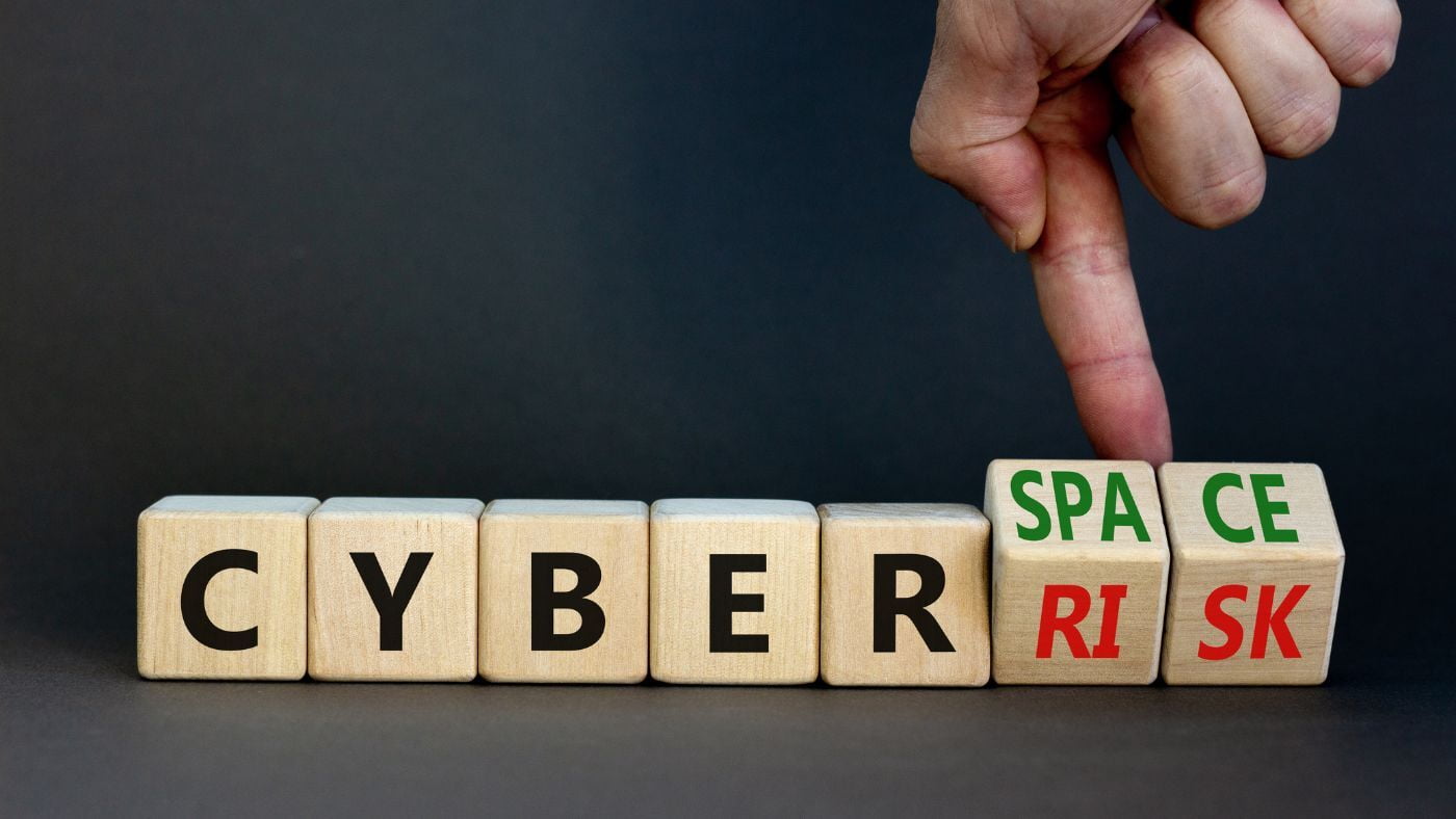 Cyber Risk scrabble type cubes being flipped over to say Cyber space